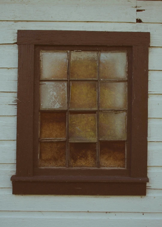 a window is shown in the wall of an old - fashioned building