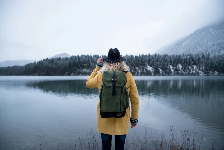 a person is looking at the water from the shore