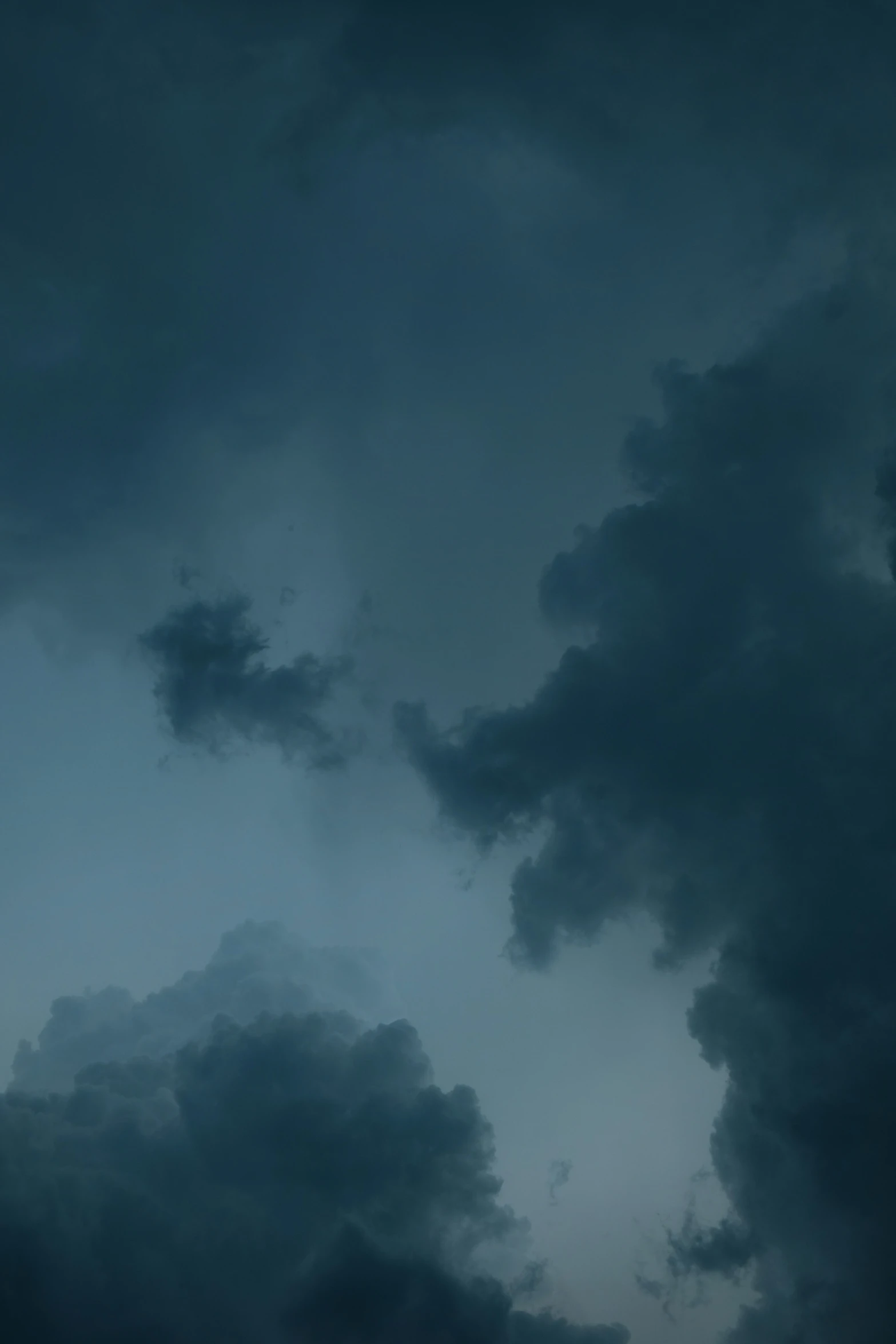 a plane flying in front of some storm clouds