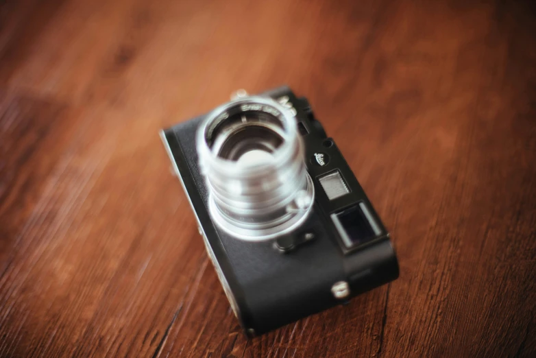 camera is sitting on the table with its lens opened