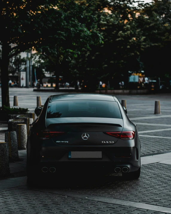 the back end of a car parked on the street