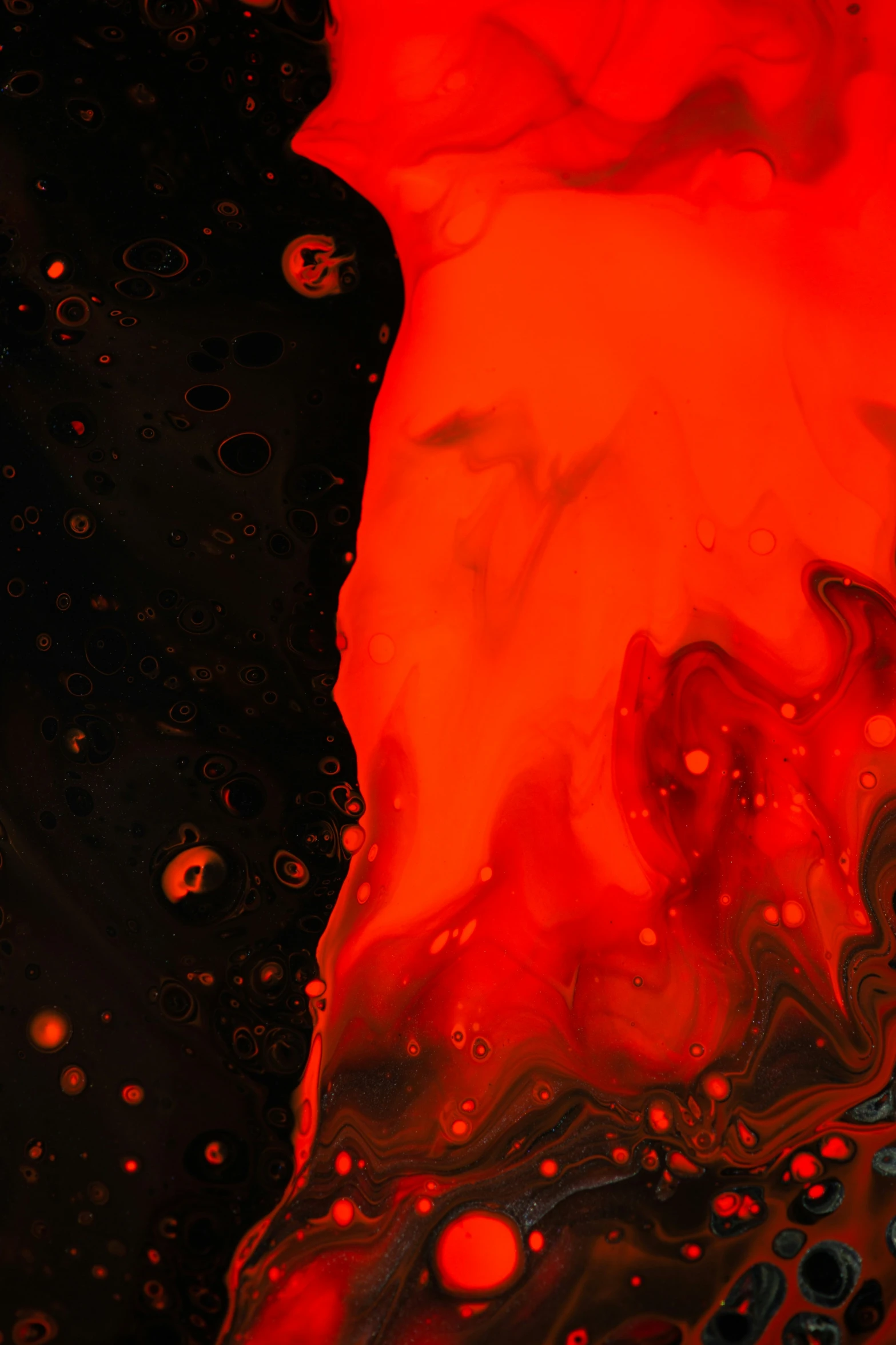 an abstract black background with orange and red shapes