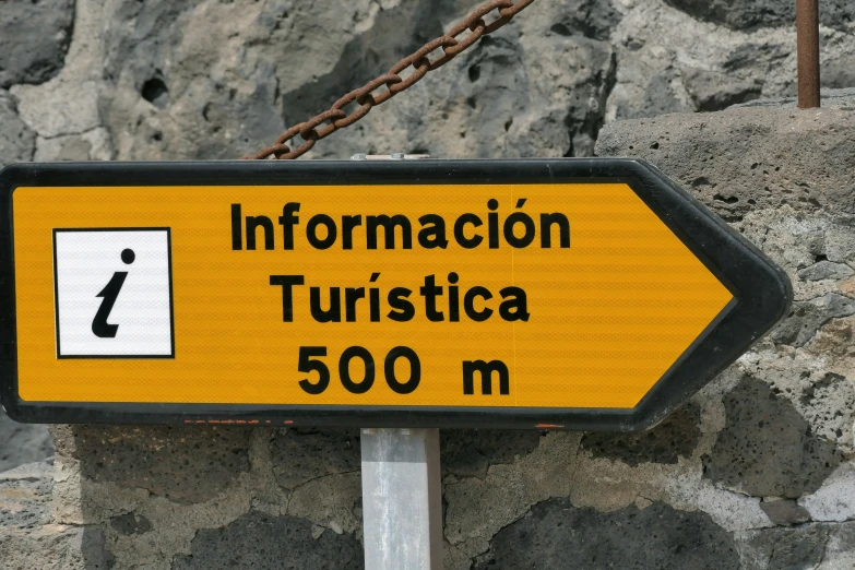a sign for an information point points in two directions