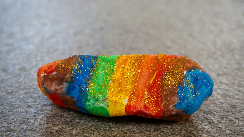 close up of a rock with paint on it