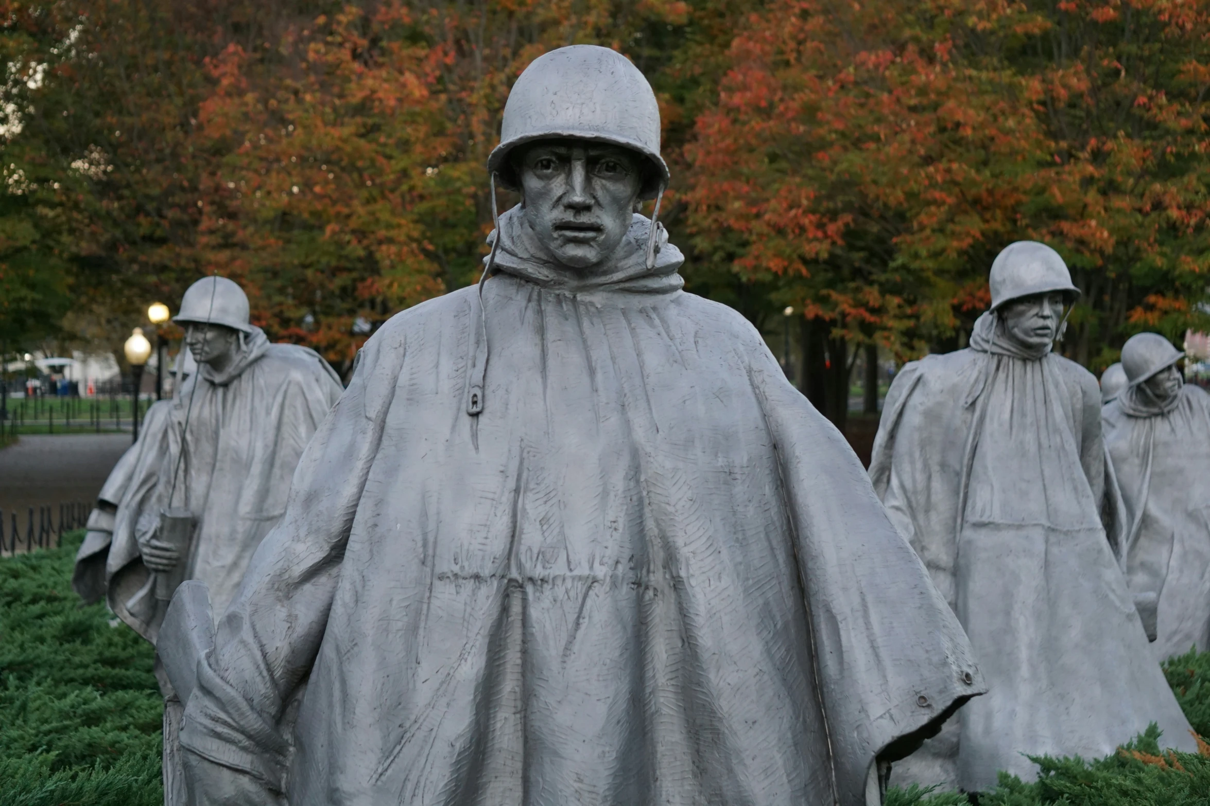 the men are all wearing helmets and robes