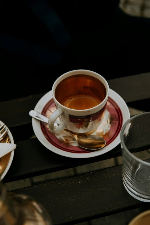 a couple of cups of coffee on a wooden table