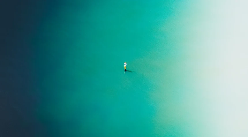 there is a man that is riding a surf board in the water