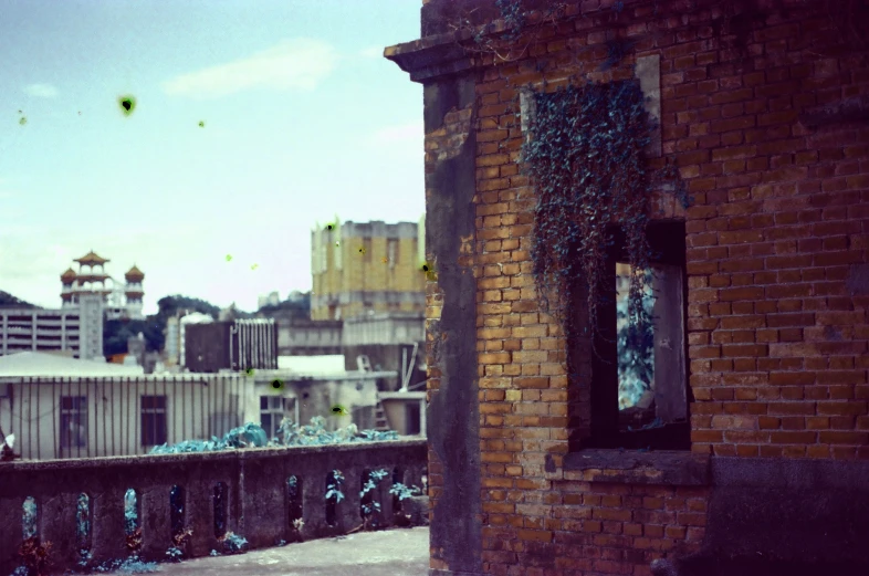 view of a city skyline through a broken window