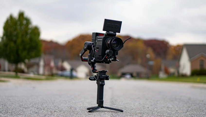 the tripod is made to stand and adjusts its camera