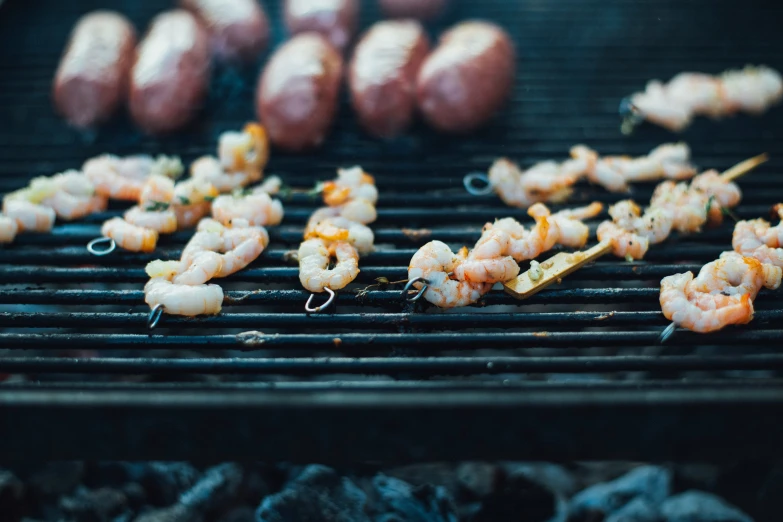 a grill with some shrimp on top of it