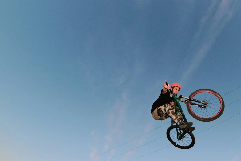a man on a bike high in the air