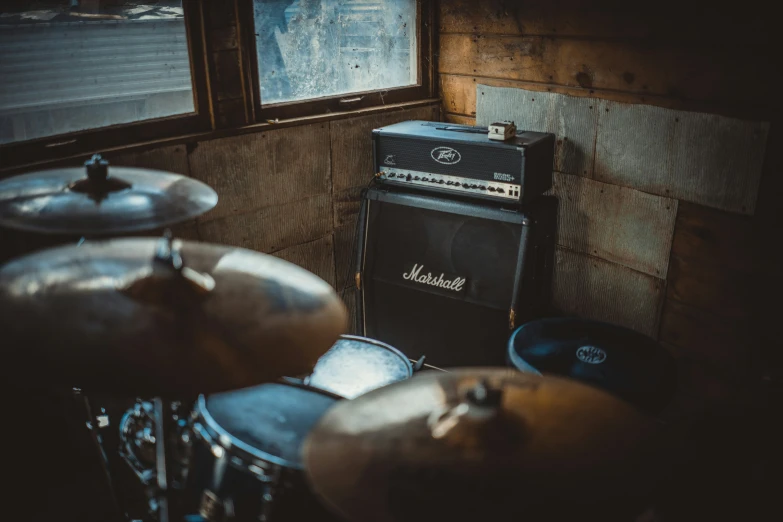 some drums and some other musical equipment in a room