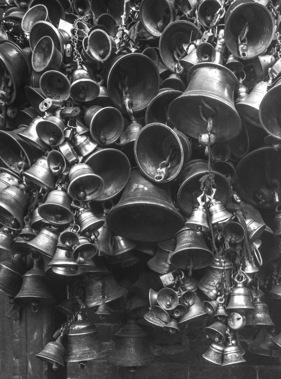 many bells on the wall of an old church