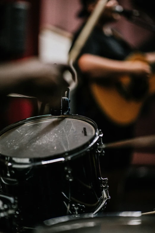 a close up of a drum and some music instruments