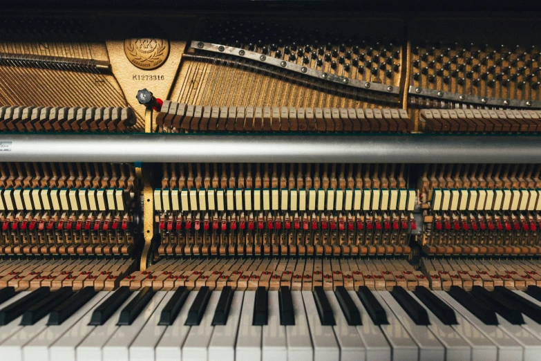 a piano sitting next to another piano and its keyboard