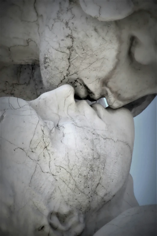 a stone sculpture with white paint and white plaster