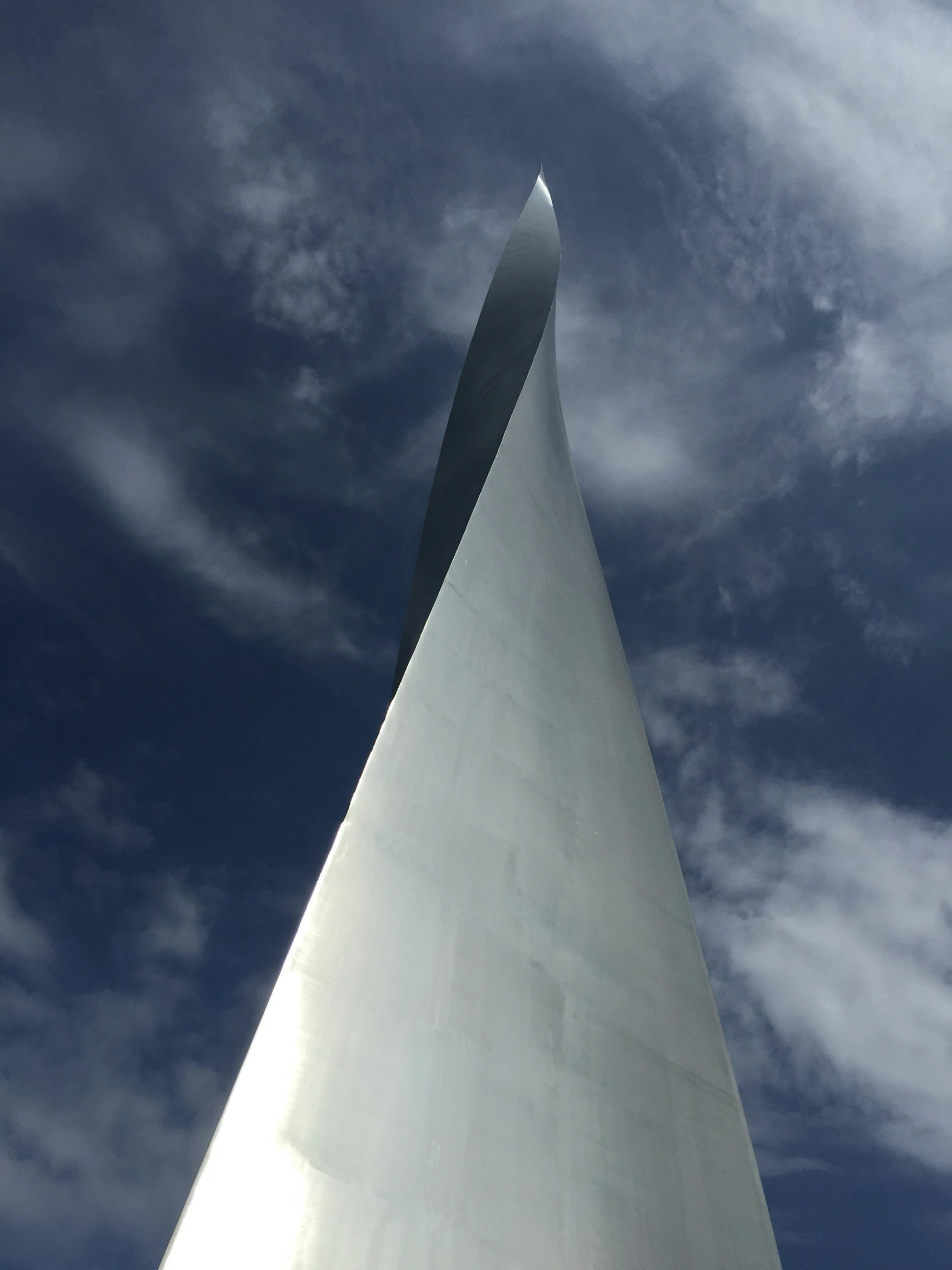 the plane is in front of a large white building