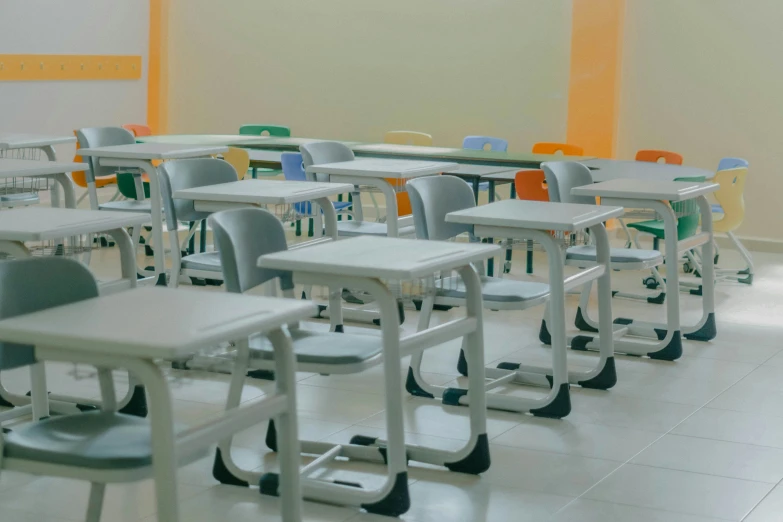 tables, chairs and laptop computers in a classroom