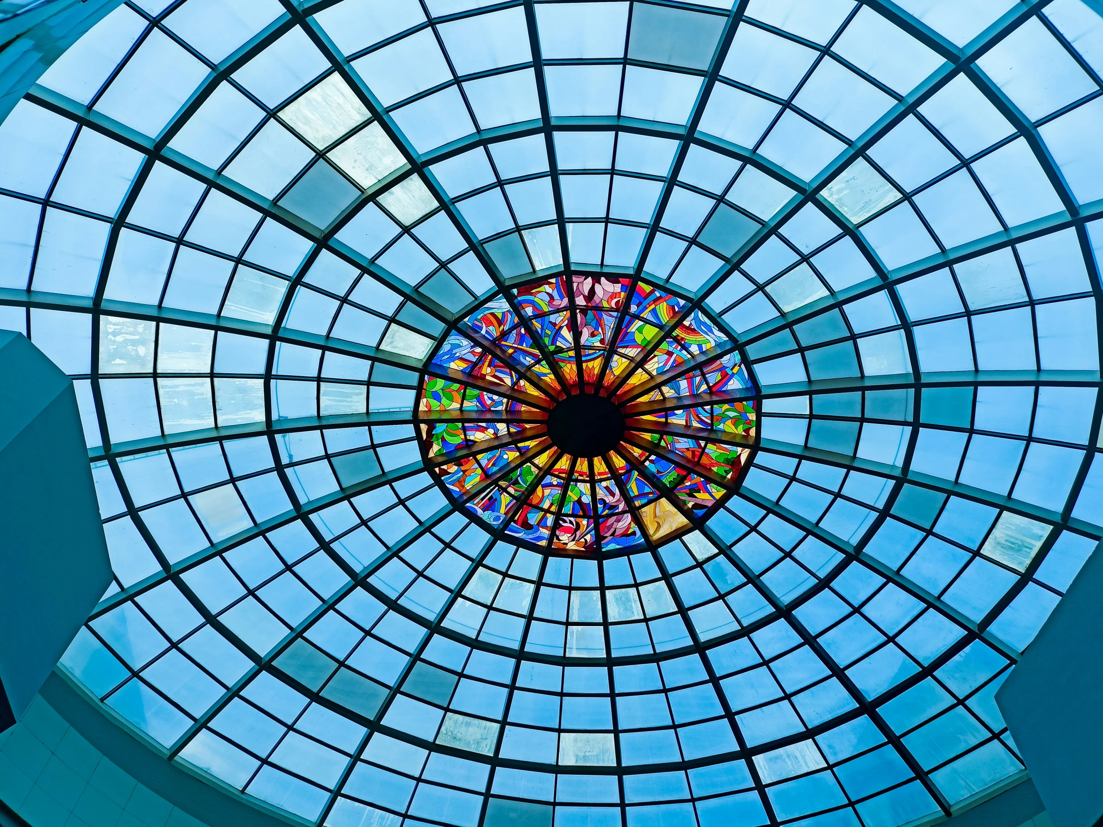 a colorful glass ceiling in a building