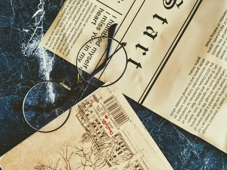 glasses resting on an old harry potter booklet