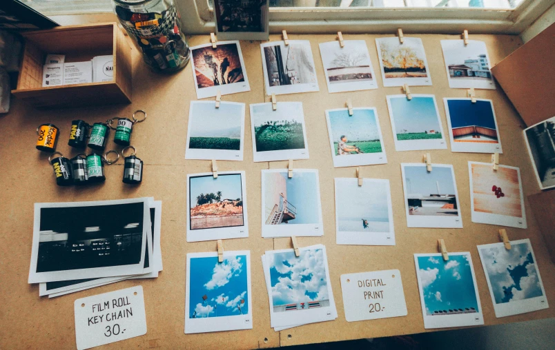 a table topped with lots of pographs and papers