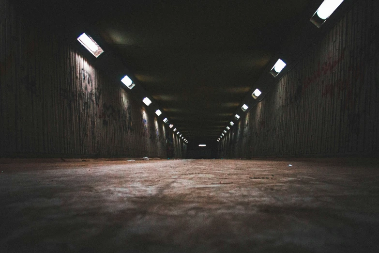 an empty hallway that has a lot of light