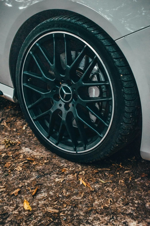 closeup view of a shiny, black rim on a car wheel