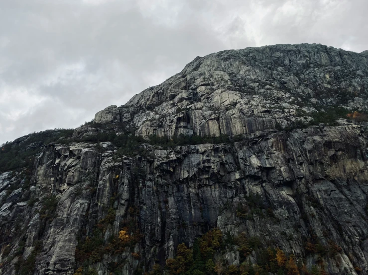 an image of a very tall rock face