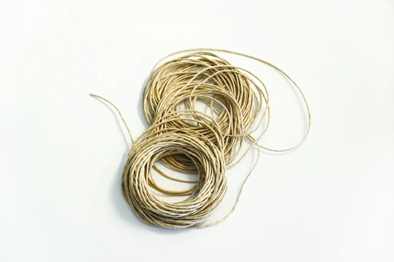 a group of twine string spools with rope