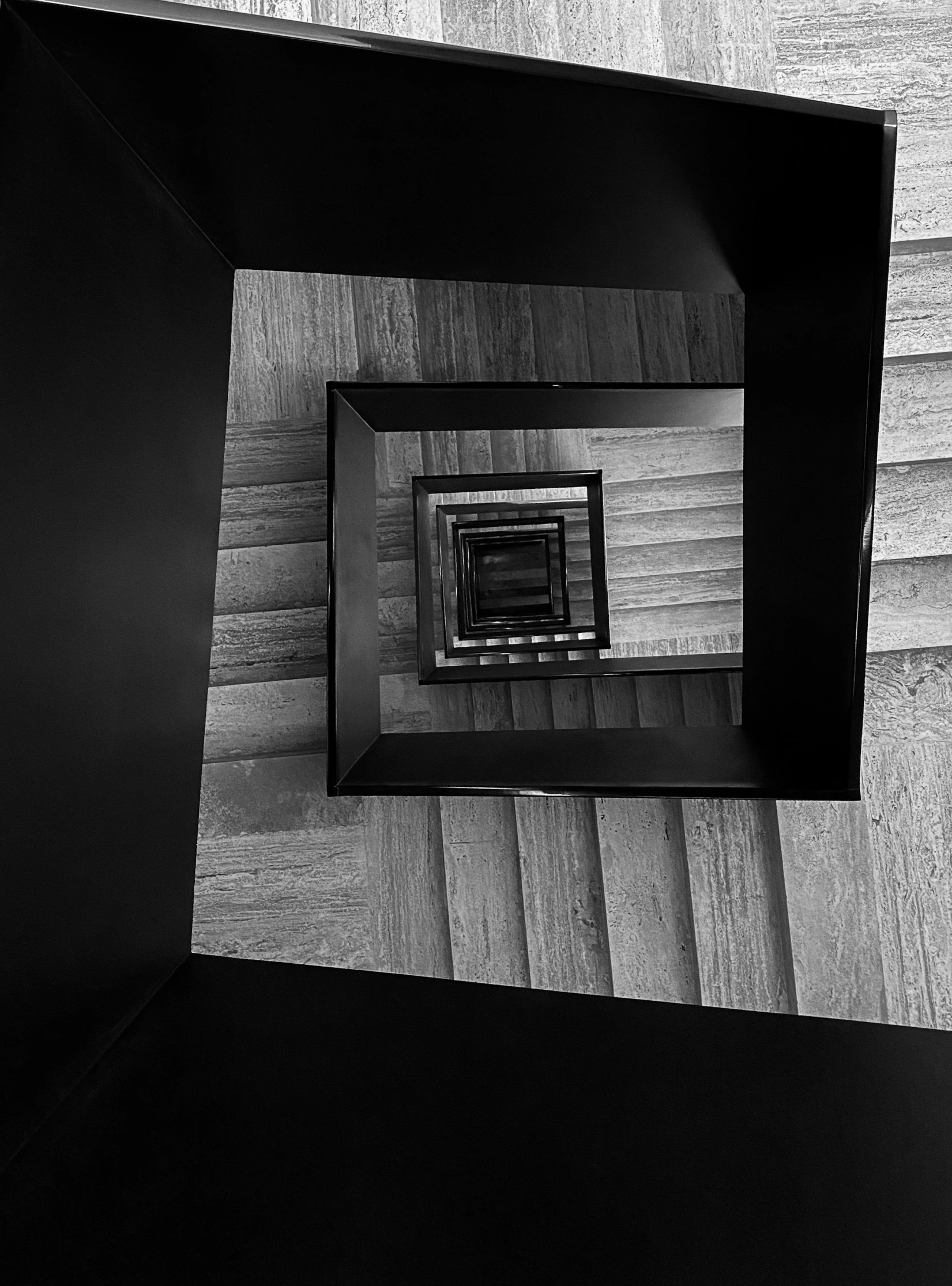 looking down at a square wooden structure