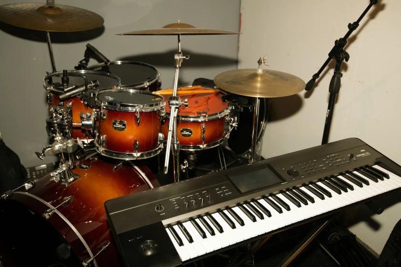 an image of a musical keyboard and drums