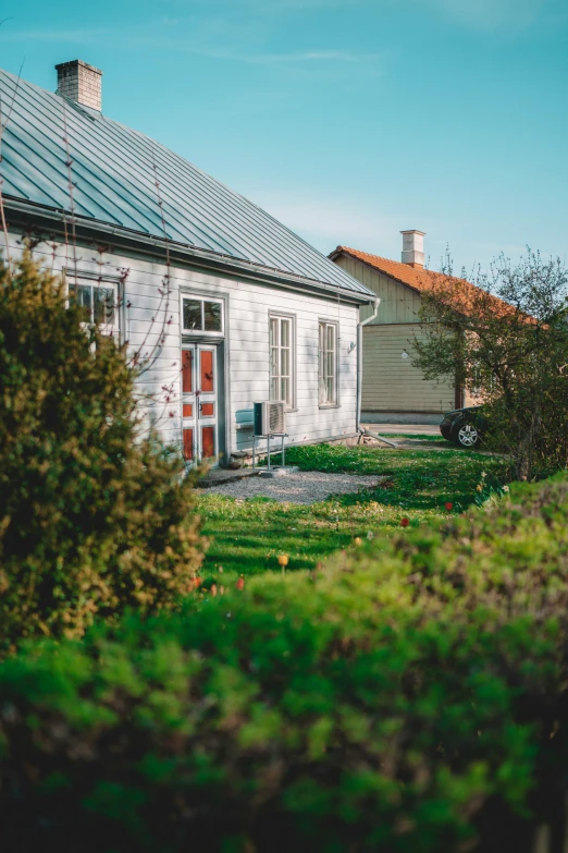 an old house that is sitting on the grass