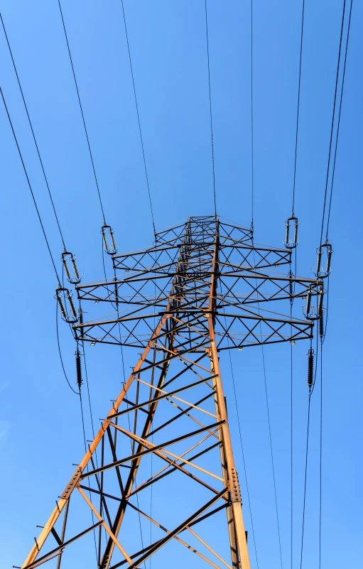 electric power lines in front of blue sky