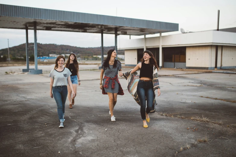 a bunch of women walking across an airport