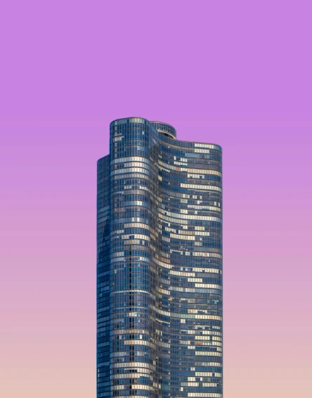 a very tall glass office building towering over a city