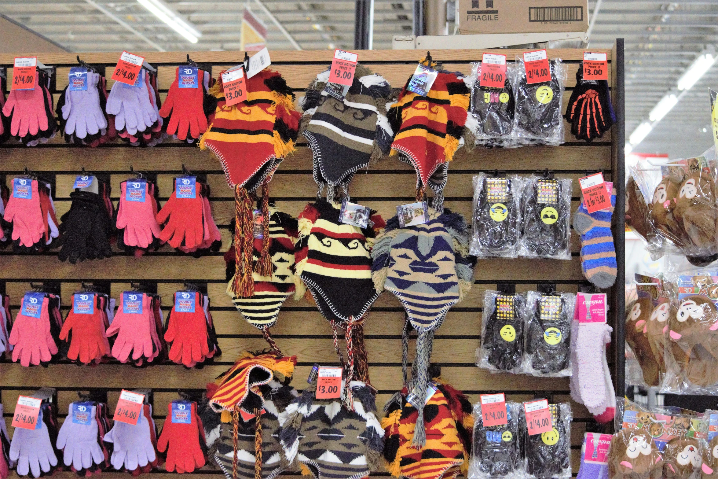 several different styles and colors of clothing displayed on shelves