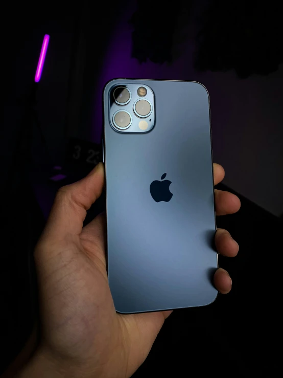 someone holding an apple iphone 11 in their hand