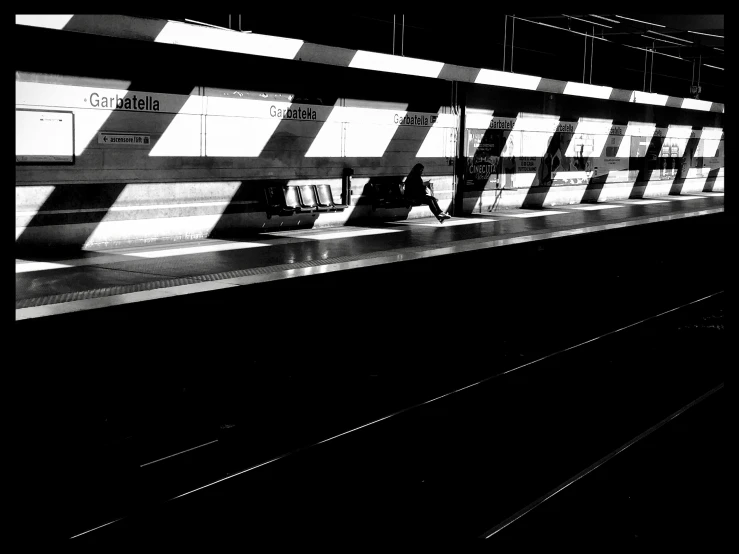 black and white pograph of the subway platform