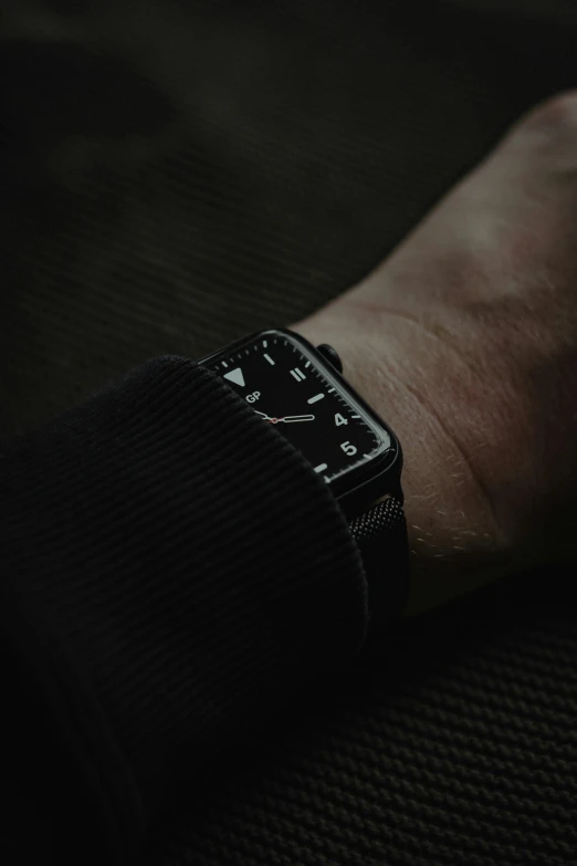 a close - up of a hand showing an analog watch