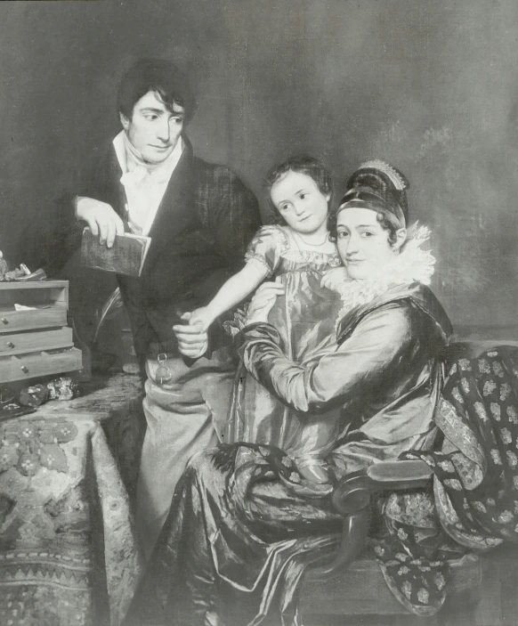 an old pograph of a family standing in a living room