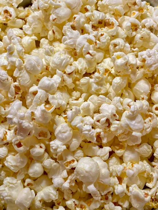 a pile of popcorn is in a big pot