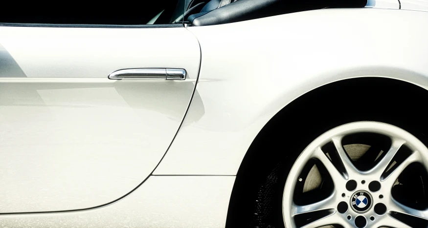 closeup of the shiny chrome finish on the wheel of a sports car