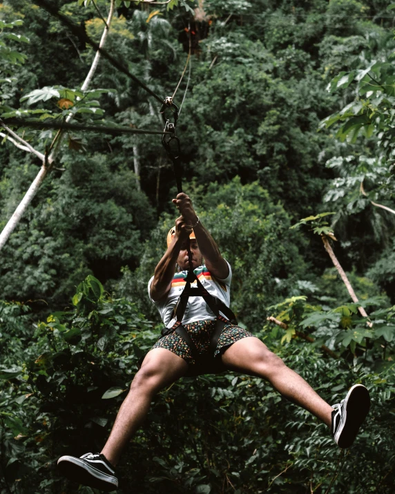 a man is jumping through the air with his hand