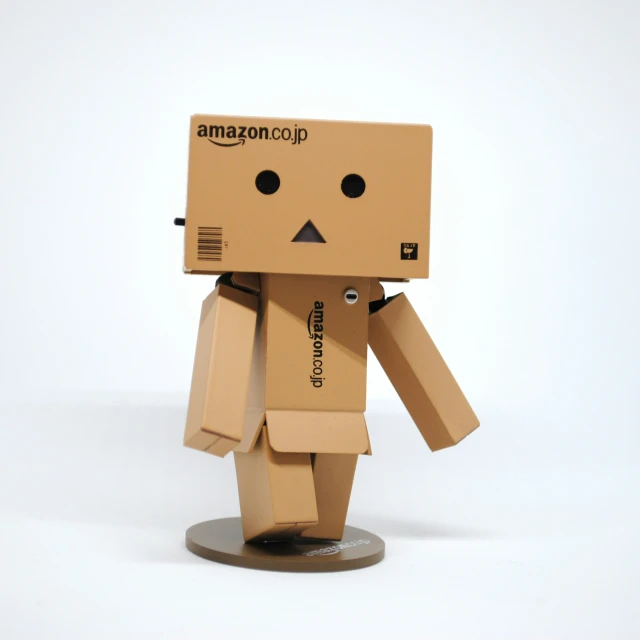 there is an cardboard robot with brown clothing on