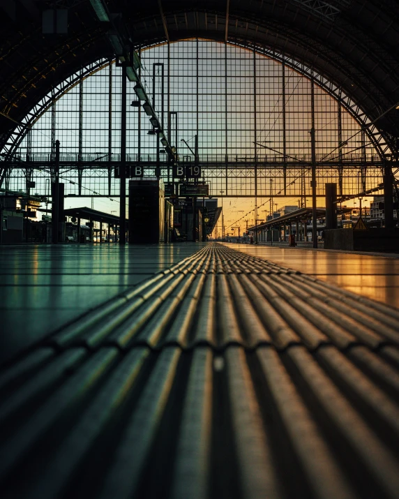 sunlight casts the shadows of a steel structure