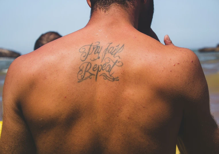 a man with a sign that reads life is really good on his back