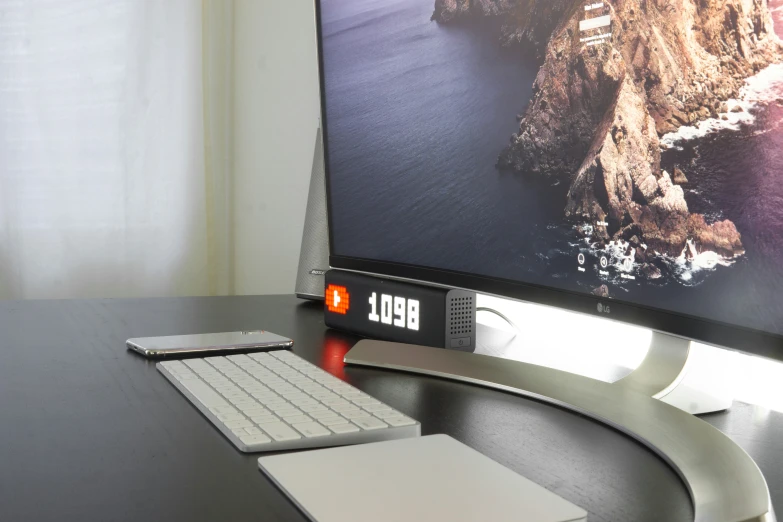 a computer screen sitting on top of a desk