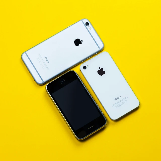 a couple of iphones sitting next to each other