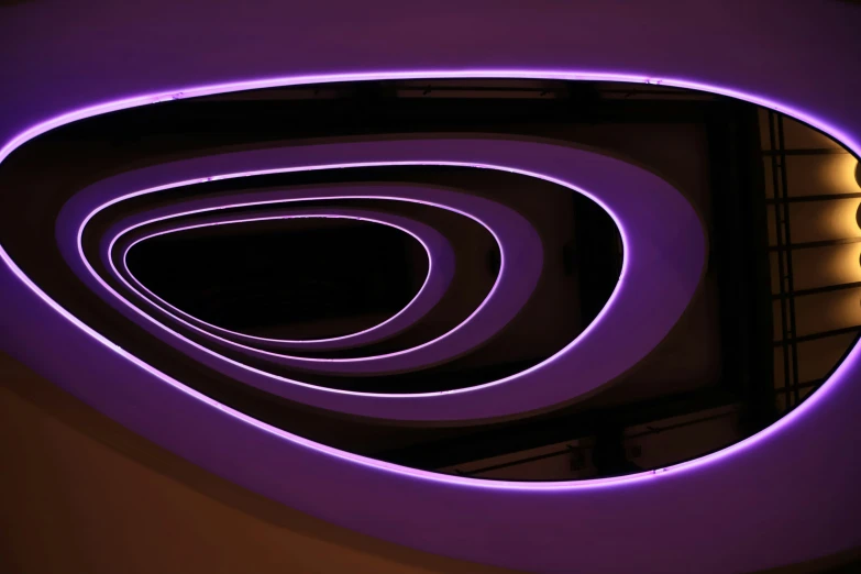 a room with many different purple neon lights