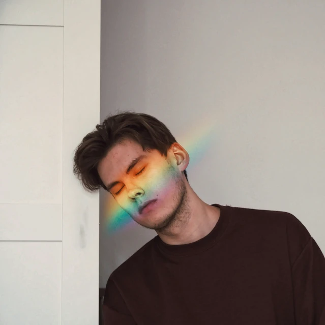 a man who has been altered with the rainbow in his eyes
